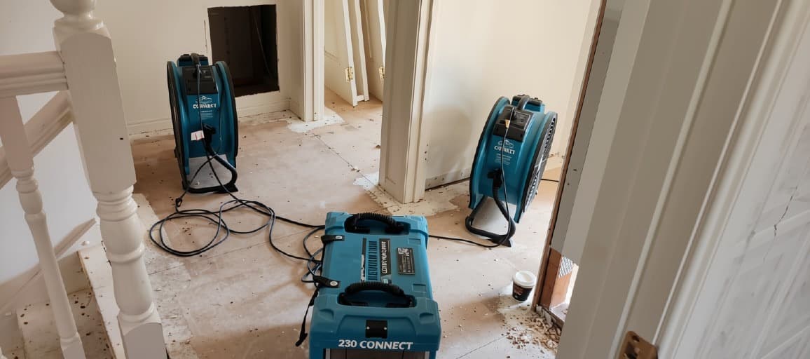 Water-damaged area being prepared for restoration by 230 Connect